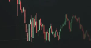 Professional trading monitor showing a market trend line going upward with technical analysis indicators.